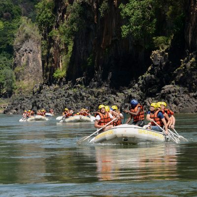 A picture of tourist doing white water rafting